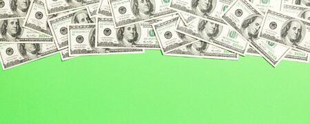dollar bills a on a light colored background. copy space, top view business concept.の写真素材