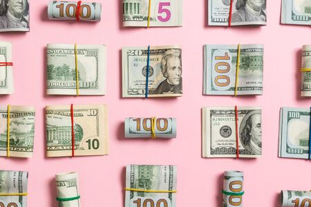 colored Background with money american hundred dollar bills on top wiev with copy space for your...