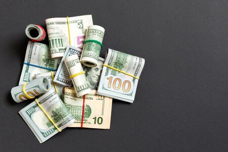 Many Stack of 100 dollar bills. Isolated on colored background top wiev with copy space.