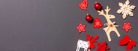 Banner Christmas black background with holiday toys and decorations. Happy New Year concept with empty space for your design.の写真素材
