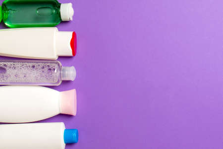 Top view of cosmetics bottles on colored background. Skin care concept with space for your design.