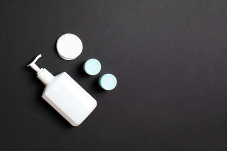 Cosmetics SPA branding mock-up, top view with copy space. set of tubes and jars of cream flat lay on...
