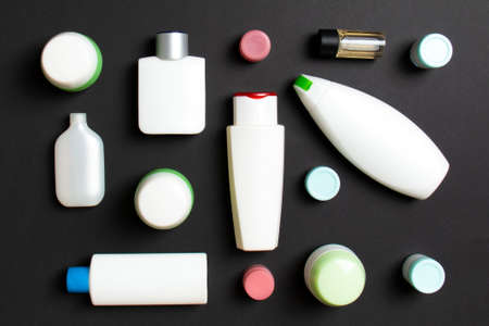 Group of plastic bodycare bottle Flat lay composition with cosmetic products on colored background...