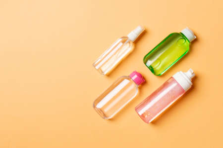 Cosmetics SPA branding mock-up, top view with copy space. set of tubes and jars of cream flat lay on colored background.の写真素材