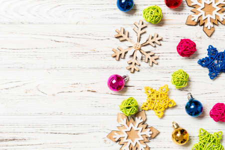 Top view of Christmas decorations and toys on wooden background. Copy space. Empty place for your design. New Year concept.の写真素材