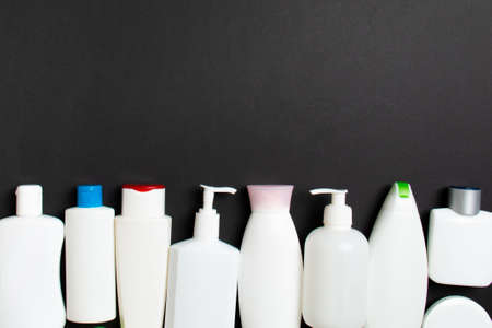 Top view of cosmetics bottles on colored background. Skin care concept with space for your design.の写真素材