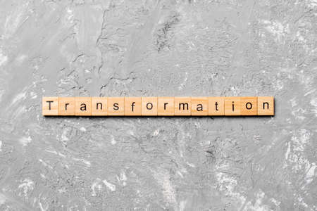 transformation word written on wood block. transformation text on table, concept.の写真素材