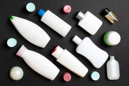 Group of plastic bodycare bottle Flat lay composition with cosmetic products on colored background empty space for you design. Set of White Cosmetic containers, top view with copy space.の写真素材