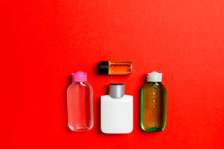 Cosmetics SPA branding mock-up, top view with copy space. set of tubes and jars of cream flat lay on colored background.の写真素材