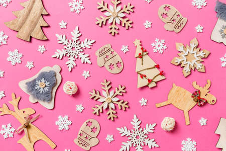 Top view of holiday decorations and toys on pink background. Christmas ornament concept.の写真素材