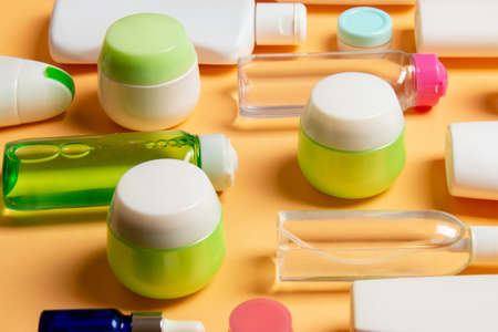 Group of plastic bodycare bottle Flat lay composition with cosmetic products on colored background empty space for you design. Set of White Cosmetic containers, top view with copy space.の写真素材