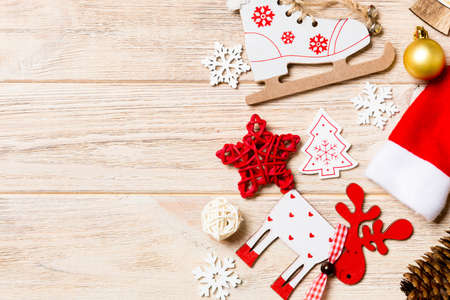 Top view of Christmas decorations and toys on wooden background. Copy space. Empty place for your design. New Year concept.の写真素材