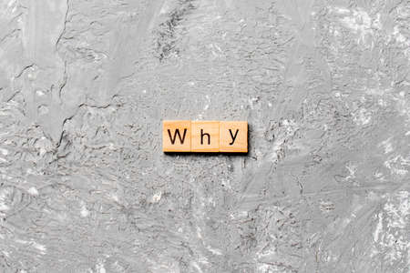 WHY word written on wood block. WHY text on cement table for your desing, concept.の写真素材