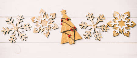 Top view of Christmas decorations and toys on wooden background. New Year holiday concept with empty space for your design.の写真素材
