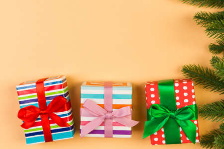 Top view of colorful holiday background made of fir tree and gift box. Happy New Year concept with copy space.の写真素材
