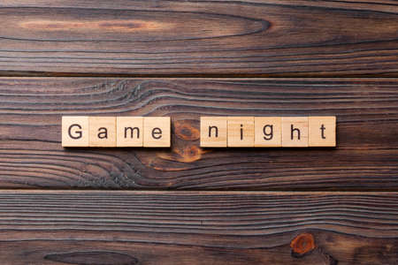 Game Night word written on wood block. Game Night text on wooden table for your desing, concept.