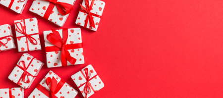 Top view colorful valentine background made of gift boxes with red hearts. Valentine's Day concept with copy space.の写真素材