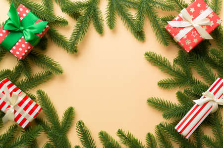Christmas decorations and fir tree branch and gift boxon dark table. Top view frame with copy space.の写真素材