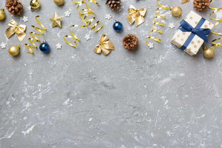 New Year composition. Christmas decor background with pine cones. Top view with copy space.