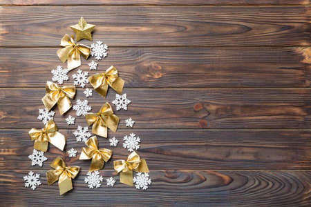Christmas tree made from colored ball decoration on colored background, view from above. New Year minimal concept with copy space.の写真素材