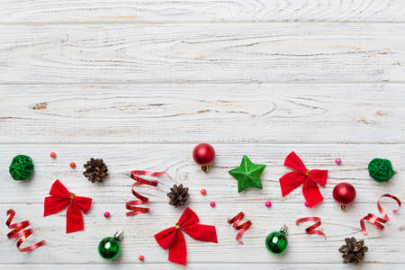 New Year composition white christmas snowflakes. Christmas decor background with pine cones. Top view with copy space.の写真素材