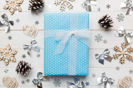 Christmas composition. Gifts box with new year decorations on colored background. Christmas, winter,...