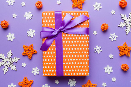 Christmas composition. Gifts box with new year decorations on colored background. Christmas, winter,...