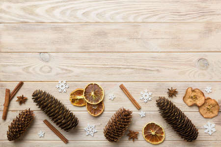 New Year composition. Christmas decor background with pine cones. Top view with copy space.の写真素材