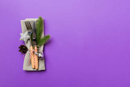 Christmas table place setting with knife, napkin and fork. Holidays new year background with copy space.の写真素材