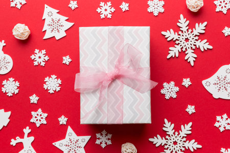 Christmas composition. Gifts box with new year decorations on colored background. Christmas, winter,...