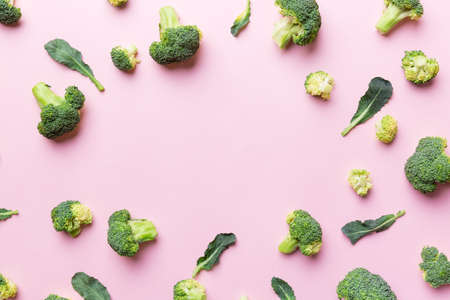 Flat lay composition with fresh green broccoli frame eith copy space on light background.の写真素材
