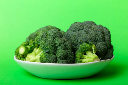 broccoli of fresh green broccoli in bowl over coloredbackground. , close up. Fresh vegetable.