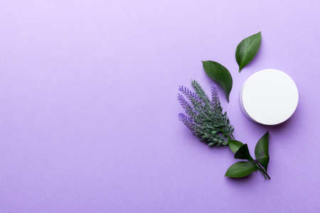 Organic cosmetic products with lavander flower and green leaves on wooden background. Copy space, flat lay.の写真素材