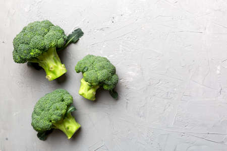Broccoli scattered on white wooden table.copy space.Top viewの写真素材