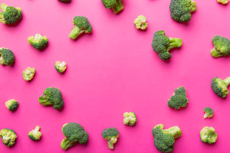 Flat lay composition with fresh green broccoli frame eith copy space on light background.の写真素材