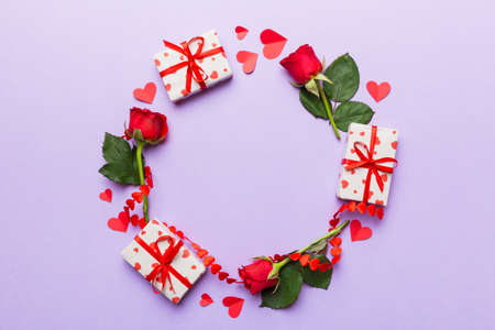 Heart made of rose, git box, heart and blank greeting card mockup on Colored background. Top view, flat lay, copy space Holiday, Mothers Day, birthday concept.の写真素材