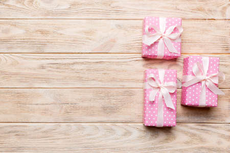 Valentine day composition: red gift box with bow and heart. Christmas present. View from above. Space for text. Holday greeting card.の写真素材