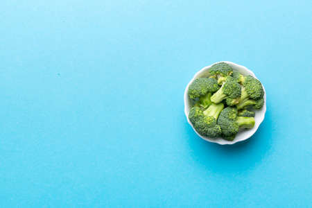 broccoli of fresh green broccoli in bowl over coloredbackground. , close up. Fresh vegetable.の写真素材