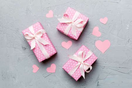 Valentine day composition Background: red gift box with bow and heart. Christmas present. View from above. Holday greeting card.の写真素材