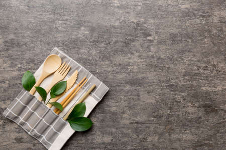 Eco friendly reusable recyclable white eco bag with kitchenware on Colored background. Concept zero waste.の写真素材