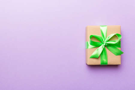 Holiday present box over colored background, top view. Copy space for design.の写真素材
