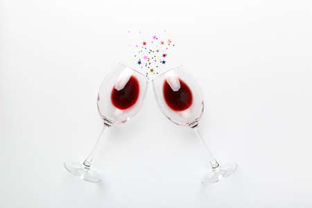 Many glasses of red wine at wine tasting. Concept of red wine on colored background. Top view, flat lay design.の写真素材