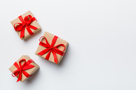 Valentine day composition: red gift box with bow and heart. Christmas present. View from above. Space for text. Holday greeting card.の写真素材