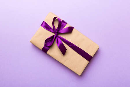 Holiday present box over colored background, top view. Copy space for design.の写真素材