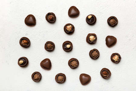 Different kinds of chocolates on colored table close-up. Top View and Flat Lay.