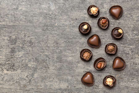 Different kinds of chocolates on colored table close-up. Top View and Flat Lay with copy space.の写真素材