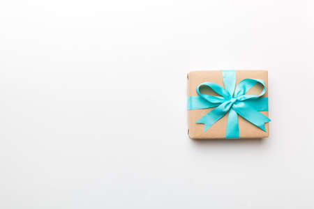 Holiday present box over colored background, top view. Copy space for design.の写真素材