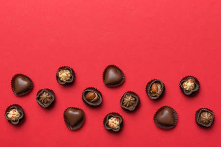 Different kinds of chocolates on colored table close-up. Top View and Flat Lay with copy space.の写真素材