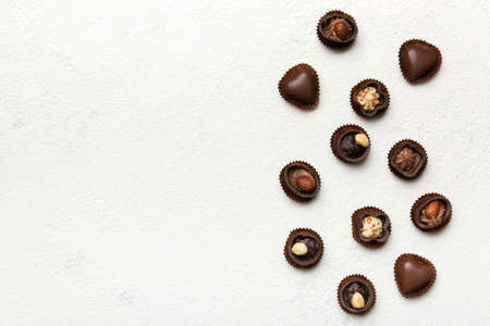 Different kinds of chocolates on colored table close-up. Top View and Flat Lay with copy space.の写真素材