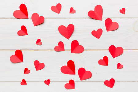 Valentine day background with red hearts, top view with copy space.